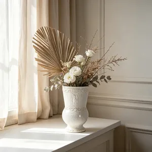 Detail of French vintage relief on a white ceramic flower vase for home decor