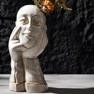 Artistic human face shaped white ceramic flower vase for minimalist home shelf decor
