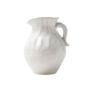 Minimalist white ceramic vase with organic hand-crafted texture for modern home decor