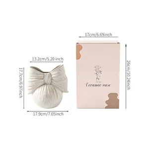 Elegant ceramic bow-shaped vase dimensions and packaging box specifications in cm and inches