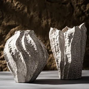 Pair of artistic Nordic ceramic vases with unique textured surface for home decoration