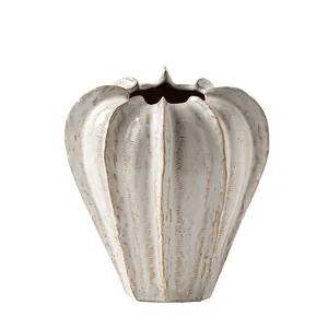 Textured white ceramic vase with ribbed design for home decor and floral arrangements