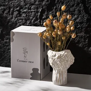 Modern Nordic cream white ceramic vase with irregular rock texture and packaging box