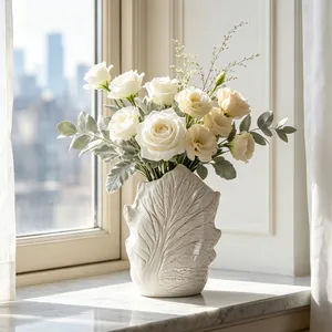 Detailed macro view of Wabi-sabi ceramic leaf vein vase with elegant white roses