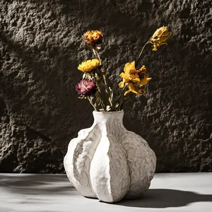 Handcrafted textured white ceramic vase for dried flowers with a unique pumpkin shape