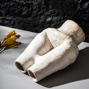 Elegant Nordic ceramic body-shaped vase in cream white finish for modern artistic home decor