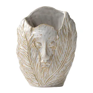 Handcrafted abstract human face art ceramic vase featuring feather texture and gold accents