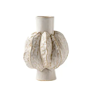 Minimalist textured off-white ceramic vase with organic leaf-like bulbous design