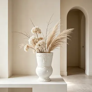 Close-up of white ceramic vase featuring vintage rabbit relief in a minimalist styled room