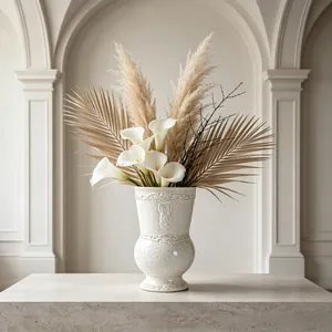 Detailed view of a French retro embossed white ceramic vase with elegant floral arrangement