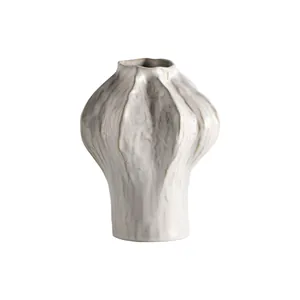 Minimalist white ceramic vase with textured organic ribbed design for home decor
