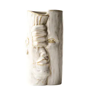 Vaso moderno in ceramica bianca con volto umano artistico per decorazioni creative