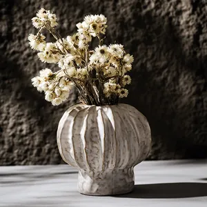 Handcrafted white ceramic ribbed flower vase for minimalist home decor display