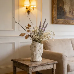 Artistic ceramic face vase with dried lavender in a vintage interior setting