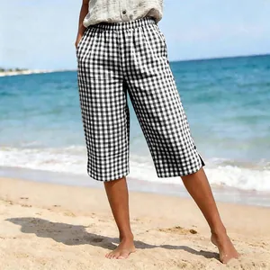 Close-up of women's black and white checkered cropped pants for summer beach holidays