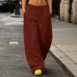 Detailed view of American street style wide-leg brown sweatpants with drawstring waist