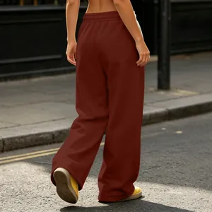 Detail view of burgundy wide-leg high street sweatpants with floor-length drapey fit