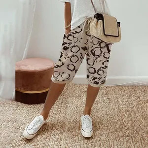 Detail view of women's printed cotton linen shorts with elastic waist and pockets
