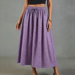 Detail view of a purple gingham cotton linen midi skirt with a high waist and drawstring