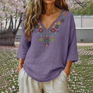 Bohemian purple cotton linen blouse with intricate floral embroidery and elegant V-neckline