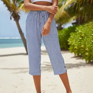 Detailed view of blue and white vertical striped cropped pants for summer casual wear