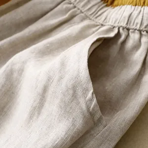 Close-up detail of pocket and natural texture on high-waist cotton linen skirt
