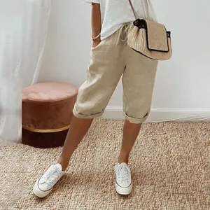 Women's beige cotton-linen capri pants feature with elastic drawstring waist and pockets