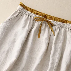 Close-up of elastic high waist on cotton-linen retro skirt with drawstring
