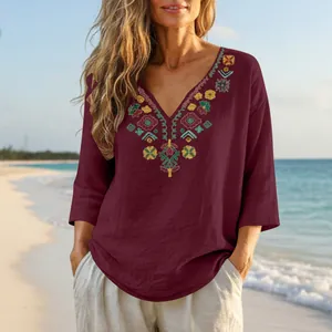 Detail view of women's vintage cotton linen top with colorful floral neck embroidery