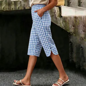 Stylish women's blue and white gingham checkered capri pants with side slit detail