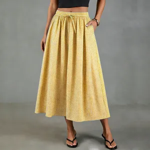 Full view of vintage yellow gingham midi skirt featuring high waist and drawstring.