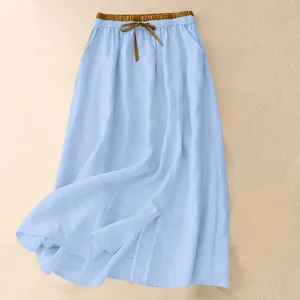 Close-up detail of a light blue cotton linen maxi skirt with drawstring elastic waist.