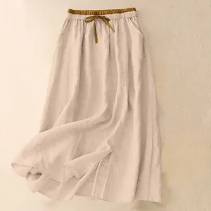 Detailed texture of a vintage beige cotton linen long skirt with elastic high waist