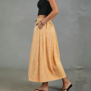 Side view of a vintage gingham cotton-linen A-line midi skirt with pockets