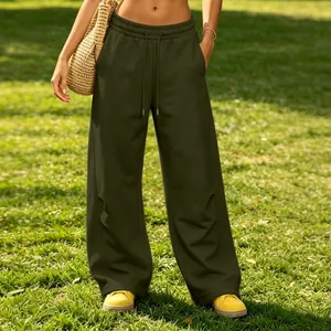Close-up detail of olive green wide-leg sweatpants with adjustable drawstring waist