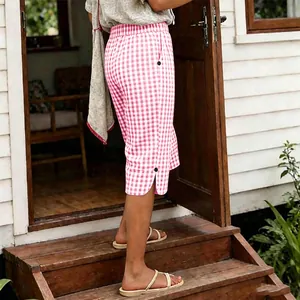 Close-up of vintage pink and white gingham cropped pants for summer vacation style