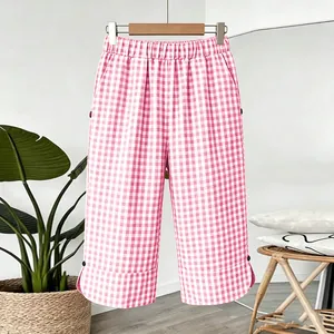 Pink and white gingham cropped trousers with elastic waist and button hem detail