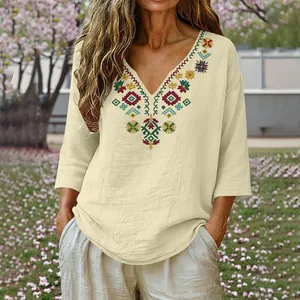 Detail showing heavy embroidery on V-neck cotton linen vintage style summer top