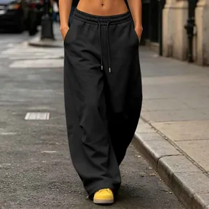 Detailed view of black wide-leg sweatpants with high waist and drawstring fit
