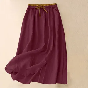 Detail view of burgundy cotton linen long skirt with elastic high waist and drawcord