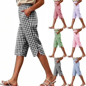 Women's multi-color vintage plaid cropped pants featuring side slits and button details