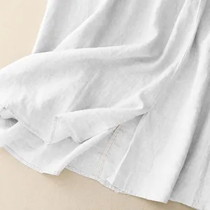 Detailed macro view showing the natural texture and soft white fabric of a linen skirt