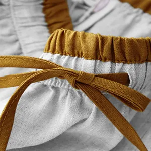 Close-up of elastic high waist and drawstring bow on cotton linen vintage midi skirt