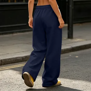 Rear view of comfortable navy blue high-waisted wide-leg sweatpants in street style