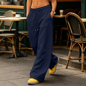 Detail view of navy blue wide-leg sweatpants with drawstring waist and side pockets
