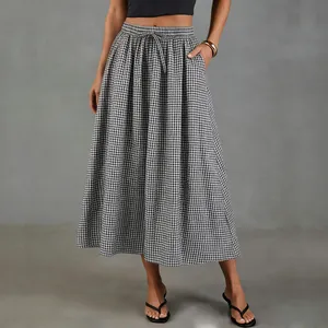 Detail view of the high waist black and white gingham cotton linen A-line maxi skirt