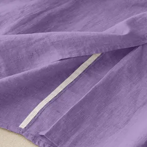 Close-up of purple cotton linen maxi skirt showing fabric texture and slit detail