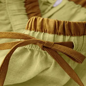 Close-up detail of the adjustable drawstring and elastic waistband on a linen skirt