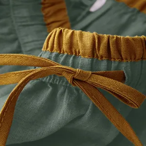 Detailed view of retro cotton linen skirt with mustard yellow drawstring and elastic waist