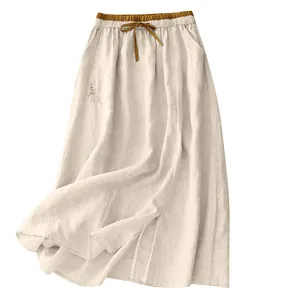 Beige loose casual high-waisted maxi skirt with brown elastic waistband and drawstring